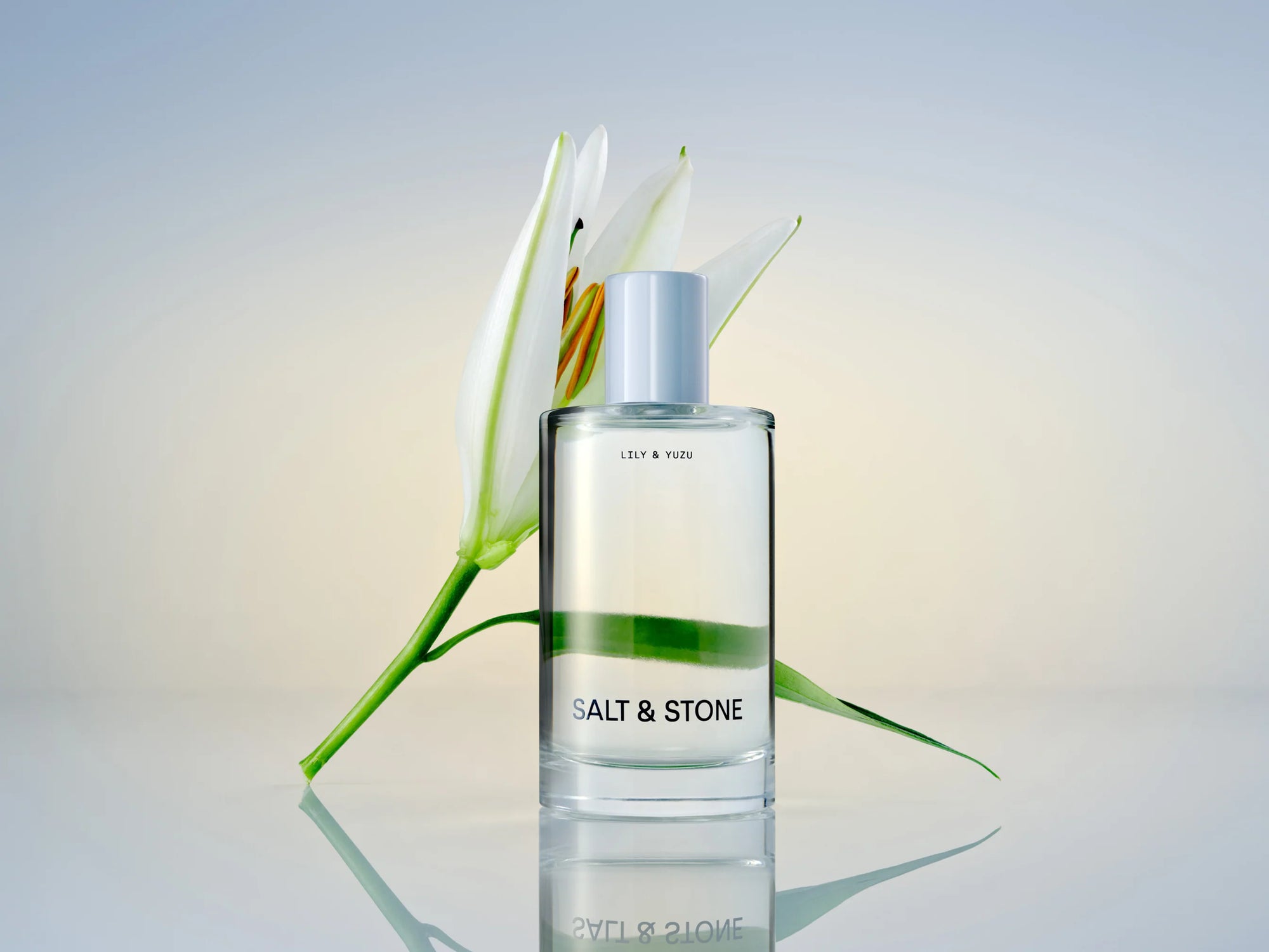 Lily and Yuzu fragrance bottle and flower